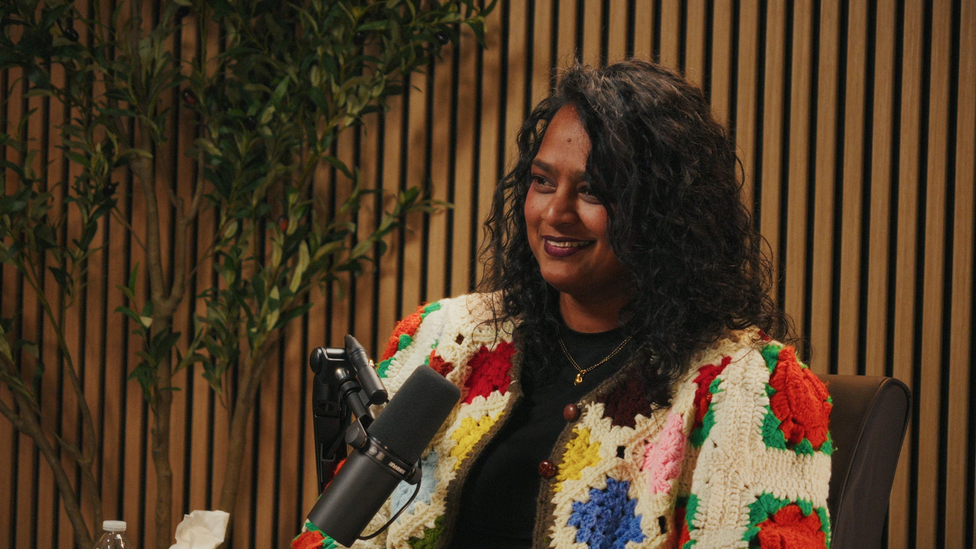 A guest smiling on the Ethos set